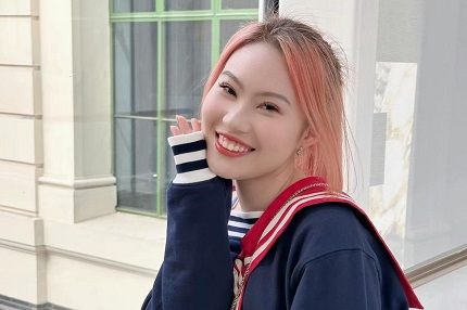 Woman poses at university