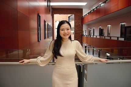 Woman stands at Deakin College, Burwood
