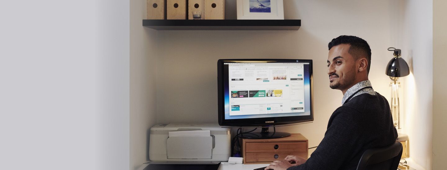 Stemp enthusiastic student at home searching for jobs online