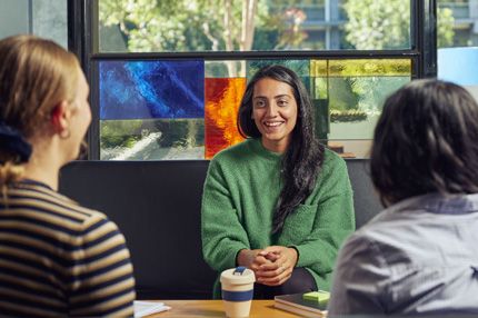 Stemp group of female students socialise on campus