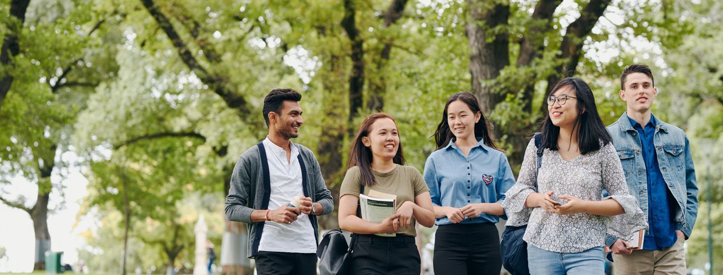 Stemp happy group of mixed students socialising outdoors
