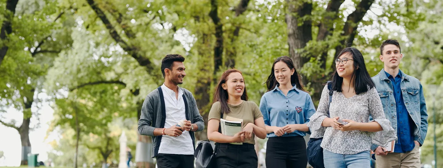 Stemp happy group of mixed students socialising outdoors