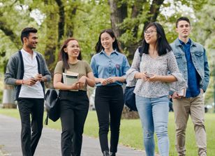 Stemp happy group of mixed students socialising outdoors