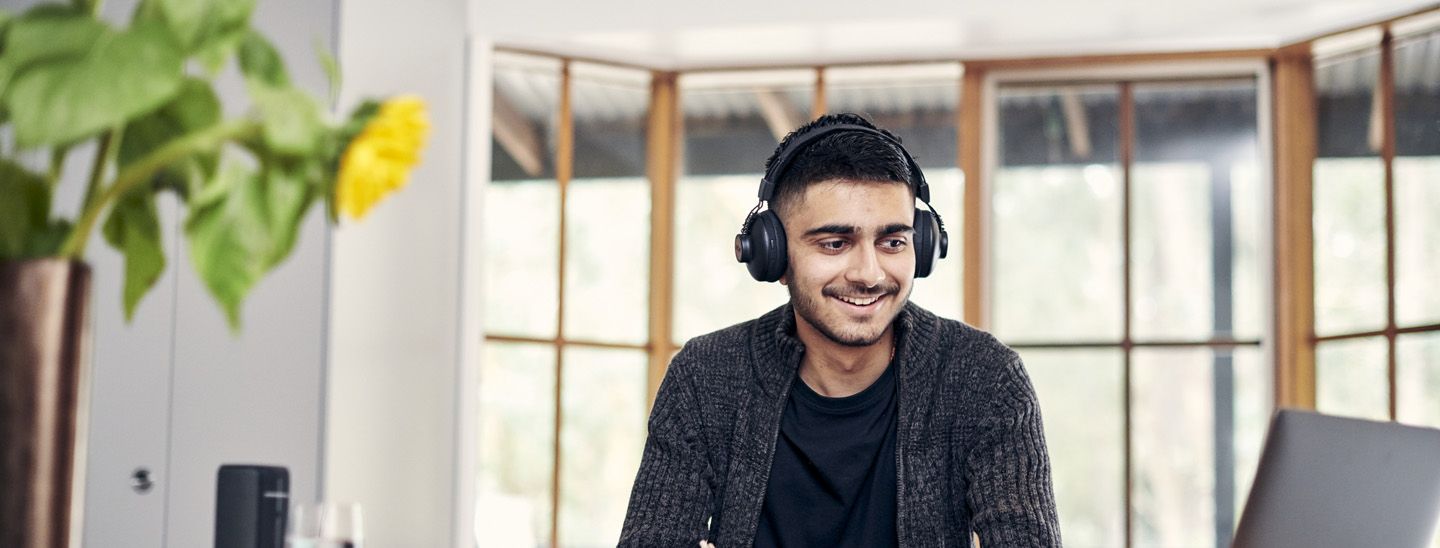 Stemp happy male student at home participating in virtual activity