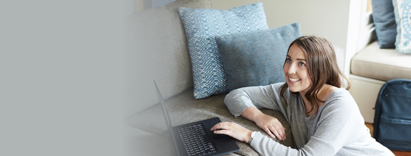 Stemp student relaxes at home on laptop