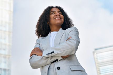 Stemp young woman poses in professional attire