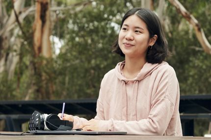 Stemp young woman works outside deep in thought