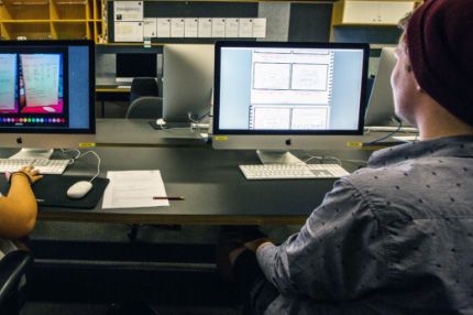 Campus couple designing in computer lab