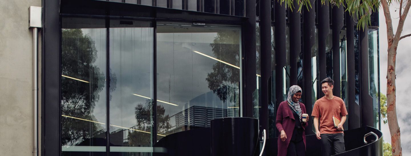 Campus couple leaving building