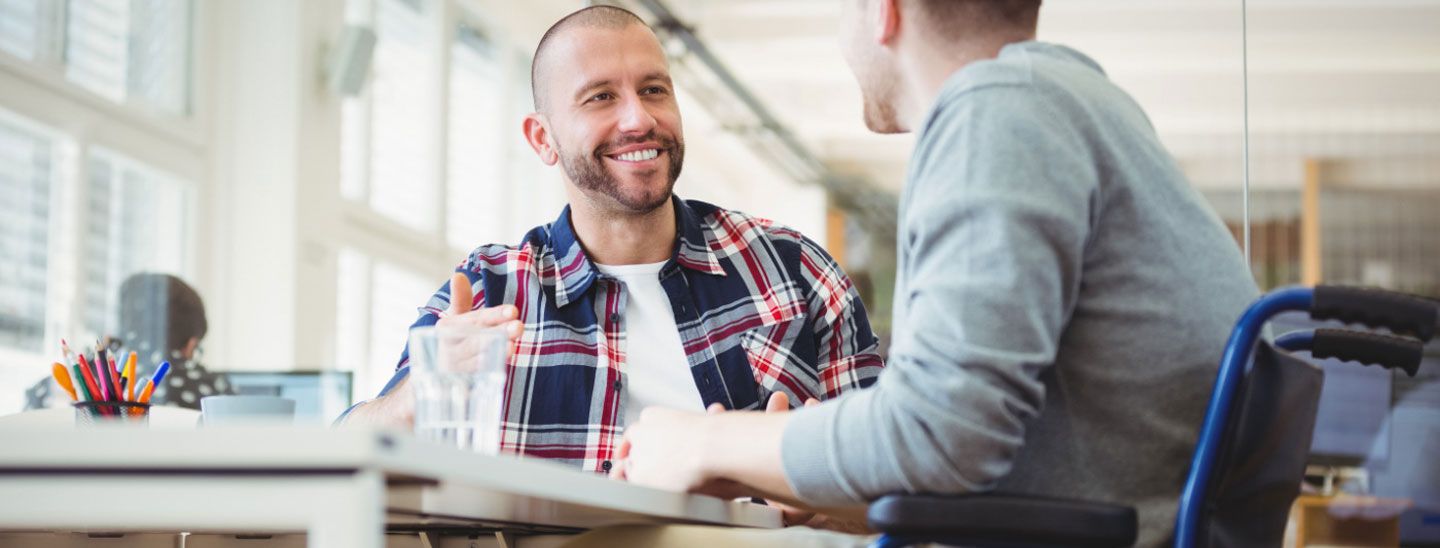 Campus couple wheelchair user at table