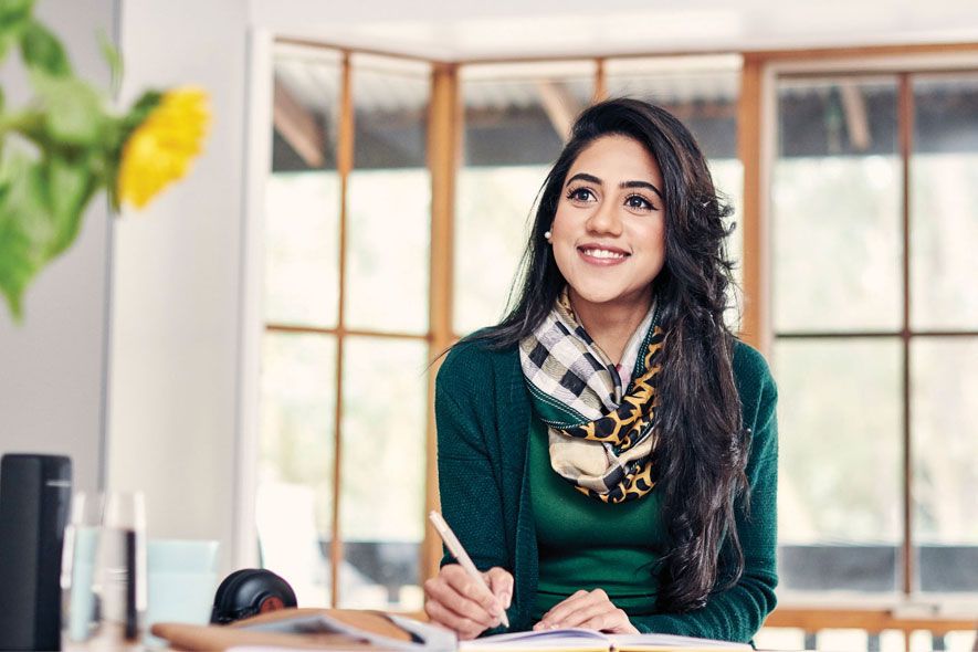 Campus female Asian note taking