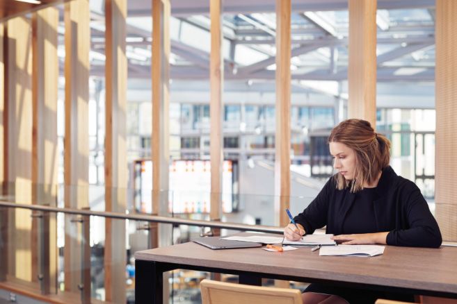 Campus female caucasian studying and writing notes