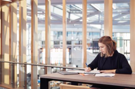 Campus female caucasian working in library