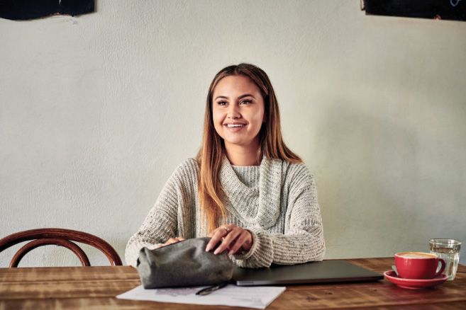 Campus female sitting with laptop