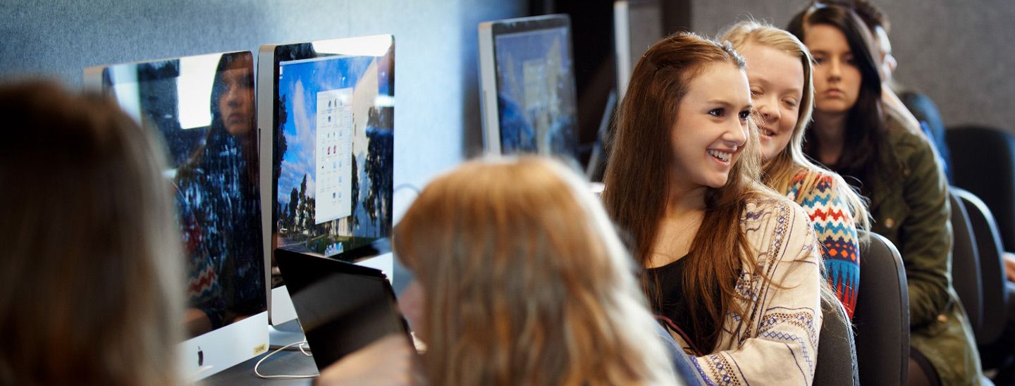 Campus group at computers in lab