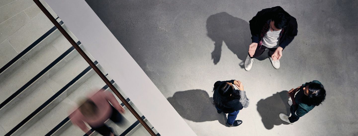 Group talking near staircase