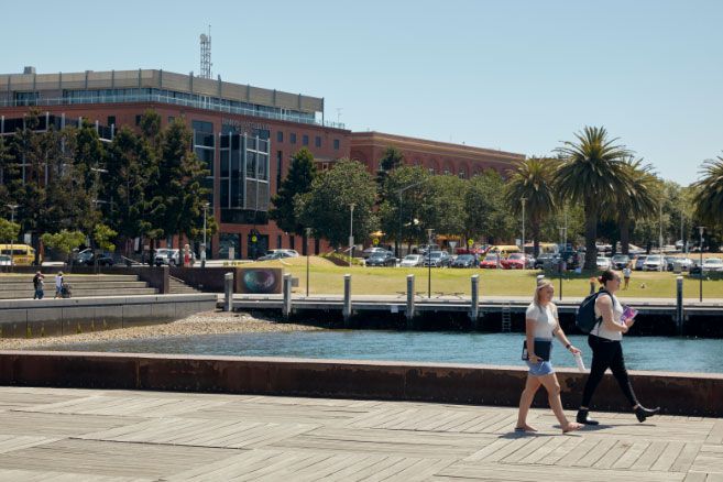 Campus group walking at waterfront