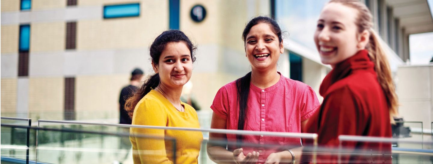 Female group smiling on campus