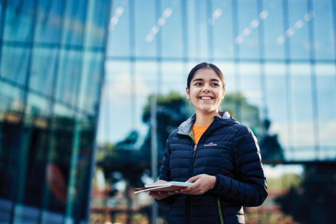 Female holding books