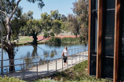 Female walking through waurn ponds