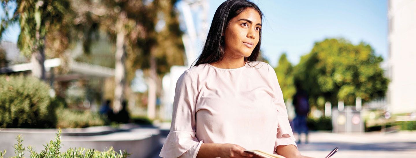 Female writing in notebook