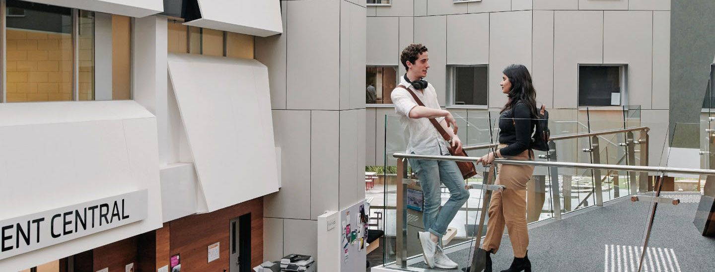 Male and female standing and talking