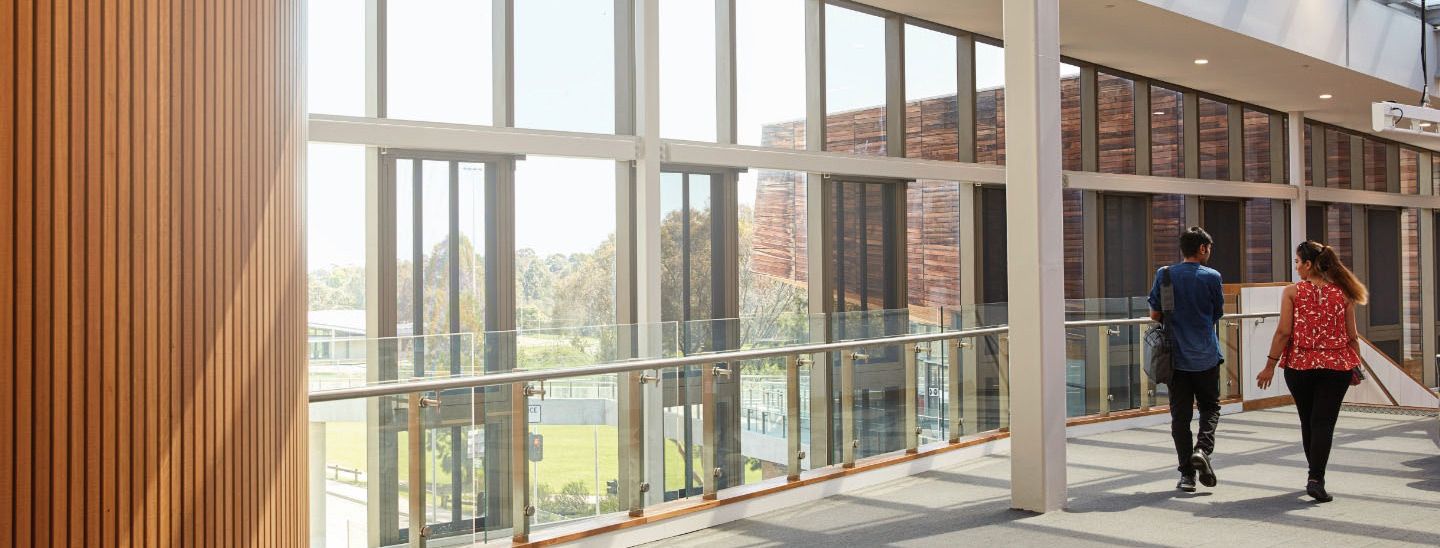 Male and female walking to class