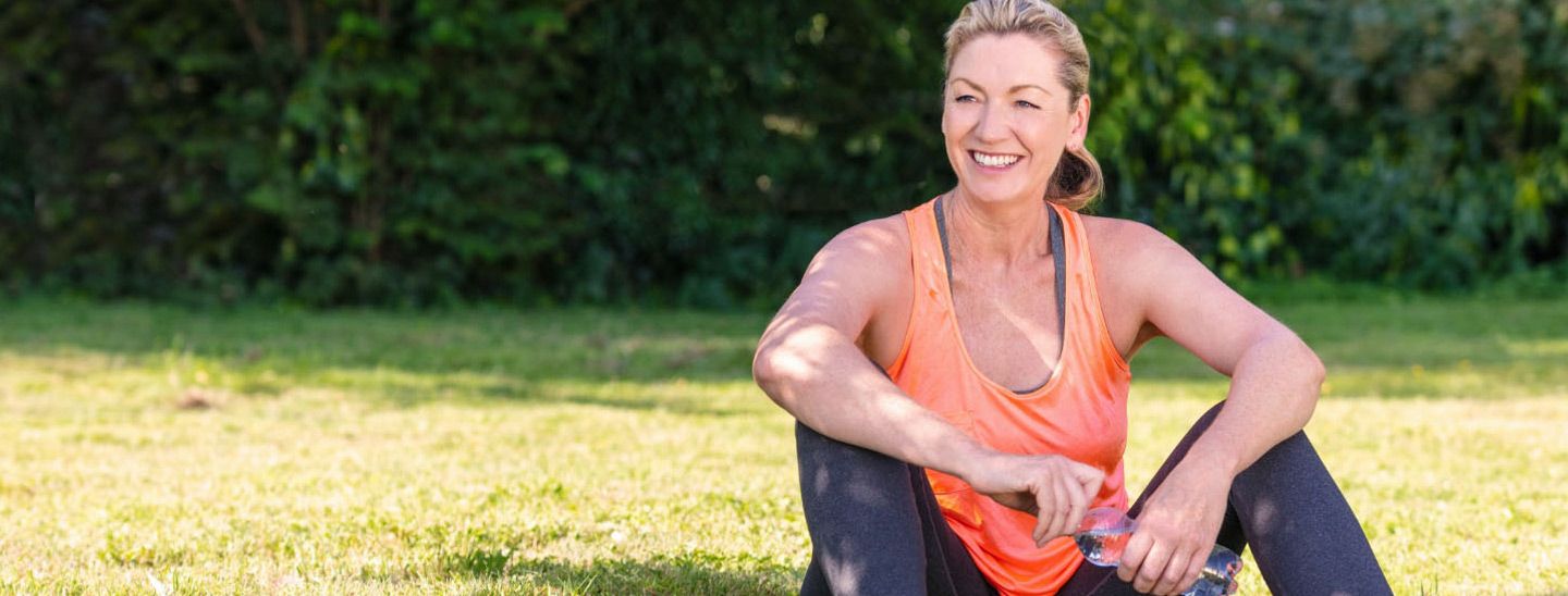 Off campus female sitting with water bottle