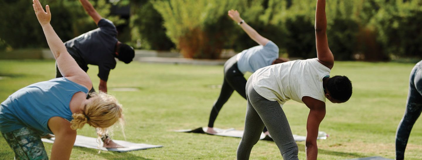 Off campus group exercising in park