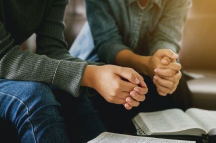 Off campus group praying