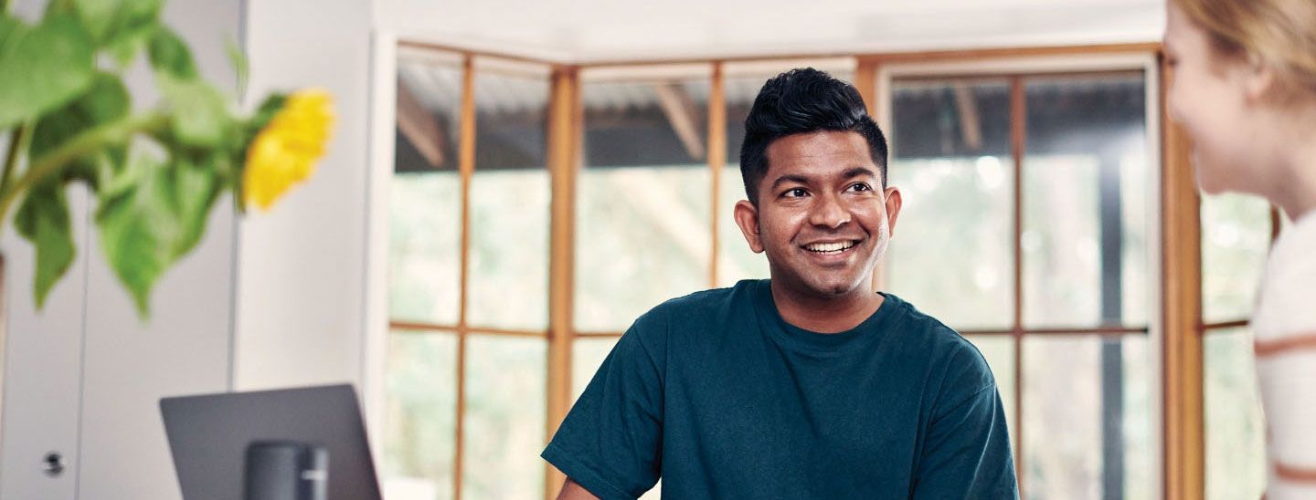 Off campus male and female studying at home