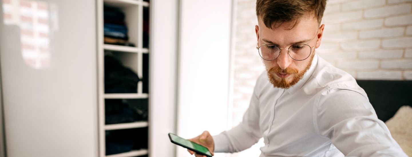 Off campus male packing suitcase